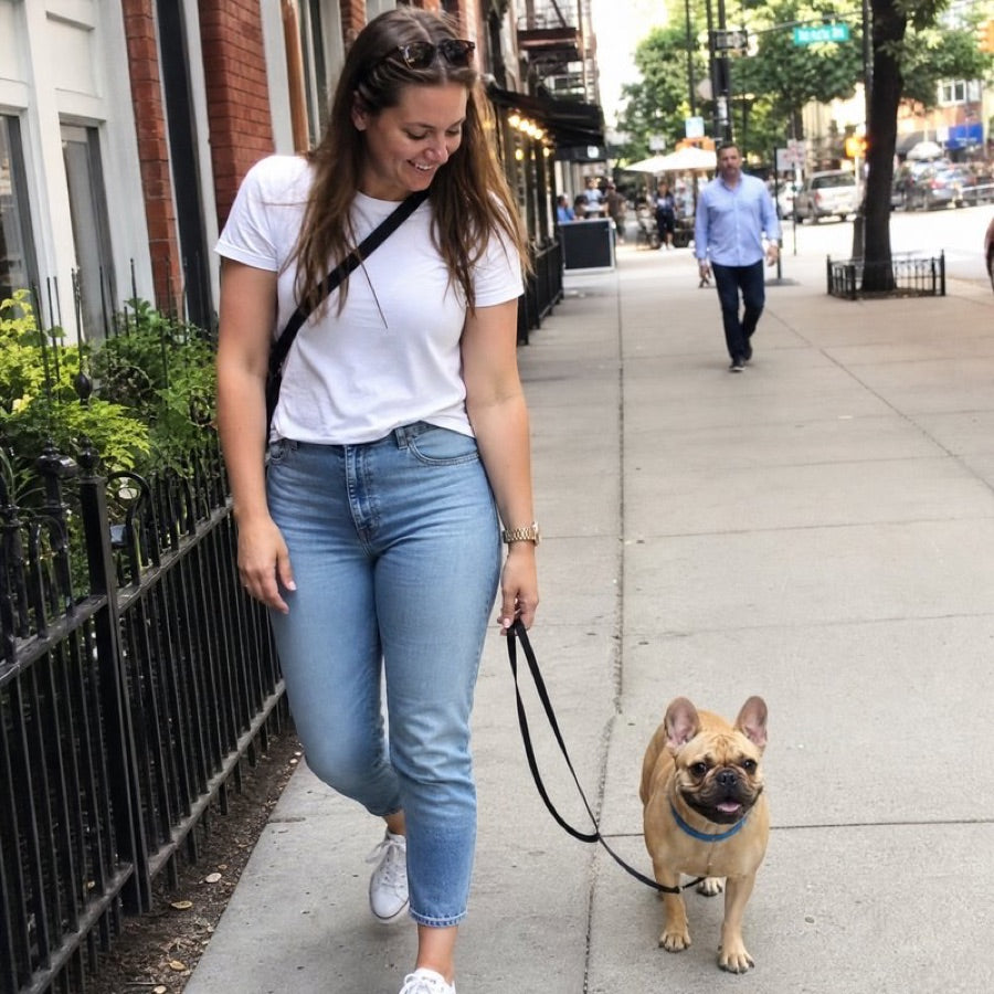 Emily R. walking Cooper, her French Bulldog in a blue CollarZen collar.