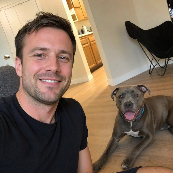 Jack A. from Detroit, MI with their dog wearing a CollarZen collar and their dog wearing CollarZen