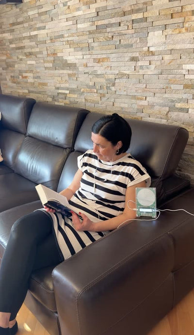 Customer reading beside the device